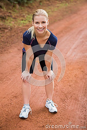 Smiling athletic blonde resting Stock Photo