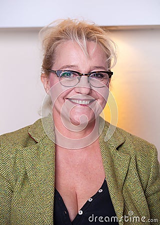 Smiling attractive middle-aged woman with glasses Stock Photo