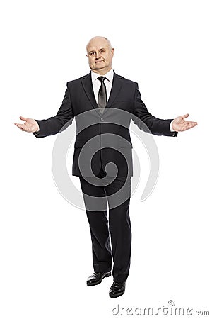 Smiling bald middle-aged man in a suit, full-length, isolated on white background. Stock Photo