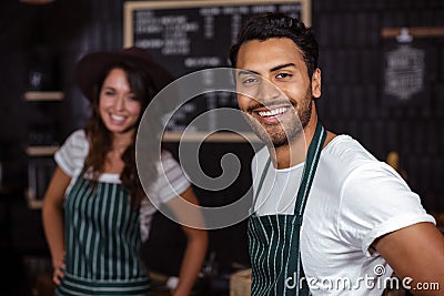 Smiling baristas looking at the camera Stock Photo