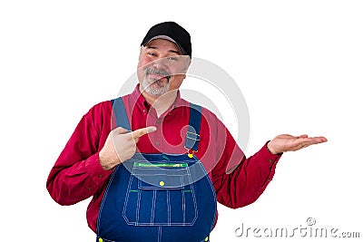 Smiling bearded worker in cap and bib overall Stock Photo