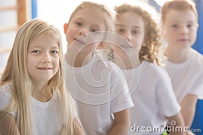 Smiling blonde girl with friends Stock Photo
