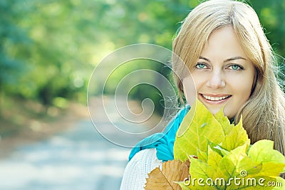 Smiling blue-eyed young woman Stock Photo