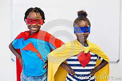 Smiling boy and girl pretending to be a superhero Stock Photo