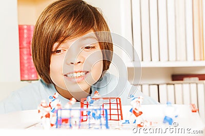 Smiling boy playing ice hockey table board game Stock Photo