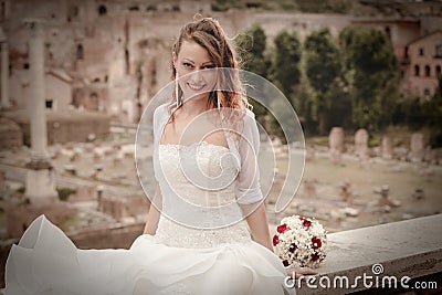 Smiling bride in the ancient city. Rome Italy. Wedding dress. Stock Photo