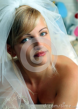 Smiling bride in white dress Stock Photo