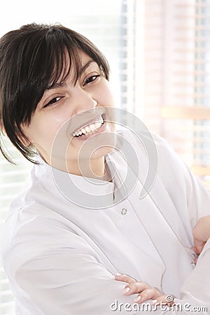 Smiling brunette in smock Stock Photo