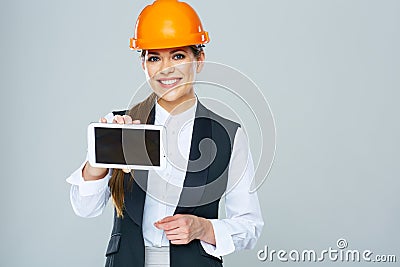 Smiling builder business woman showing tablet PC with yours inf Stock Photo