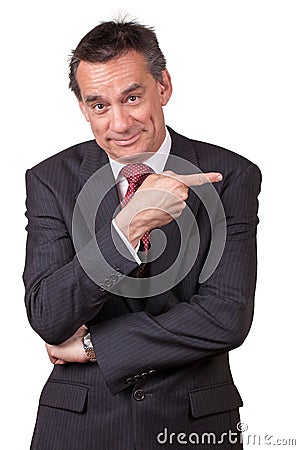 Smiling Business Man in Suit Pointing Right Stock Photo