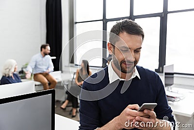 Smiling business man talking on mobile phone Stock Photo