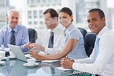 Smiling business people brainstorming Stock Photo