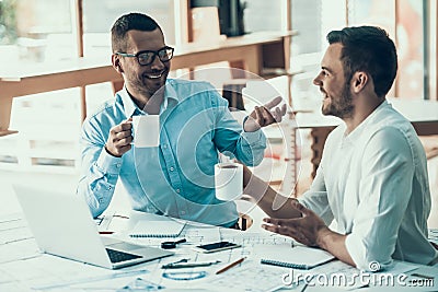 Smiling Business People on Coffee Break in Office Stock Photo