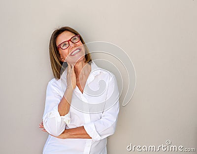 Smiling business woman with glasses looking up Stock Photo