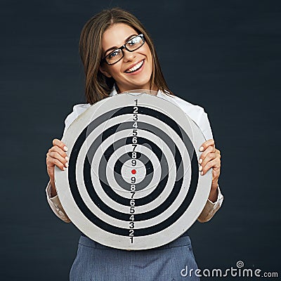 Smiling business woman holding black white target. Stock Photo