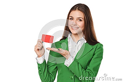 Smiling business woman showing blank credit card in green suit, isolated over white background Stock Photo