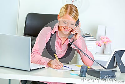 Smiling business woman talking phone Stock Photo