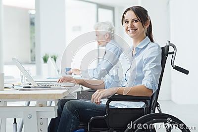 Smiling business woman in wheelchair Stock Photo