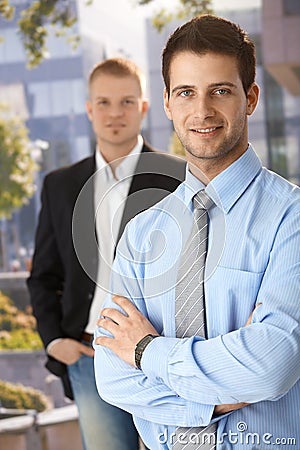 Smiling businessmen outside of office Stock Photo