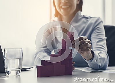 Smiling businesswoman building a successful financial chart Stock Photo