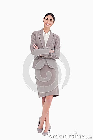 Smiling businesswoman with her arms crossed Stock Photo