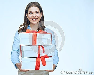 Smiling businesswoman holding bunch of gift box. Stock Photo