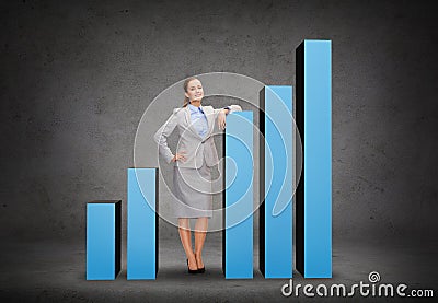 Smiling businesswoman with increasing graph Stock Photo