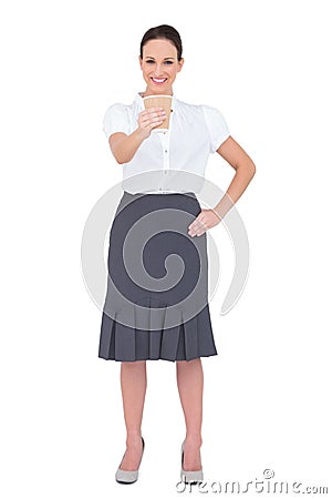 Smiling businesswoman offering coffee Stock Photo