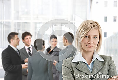 Smiling businesswoman in office lobby Stock Photo