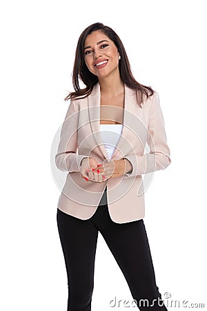 Smiling businesswoman wearing suit and standing Stock Photo