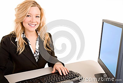 Smiling Businesswoman Working at her Desk Stock Photo