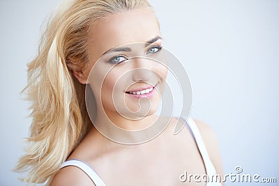 Smiling carefree beautiful blond woman Stock Photo