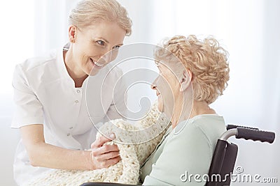 Pensioner on wheelchair sick on osteoporosis Stock Photo