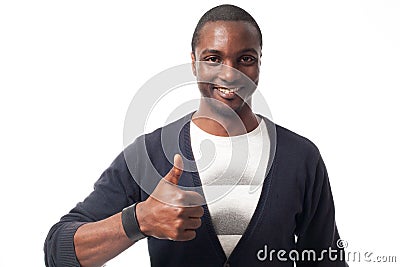 Smiling casual dressed black man with thumbs up. Stock Photo