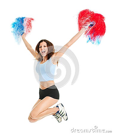 Smiling cheerleader girl posing with pom poms Stock Photo