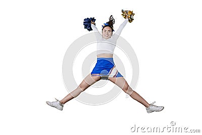 Smiling cheerleader girl raising pom poms on studio Stock Photo