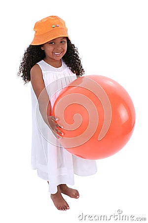 Smiling Child In Beach Hat And Dress With Orange Ball Stock Photo