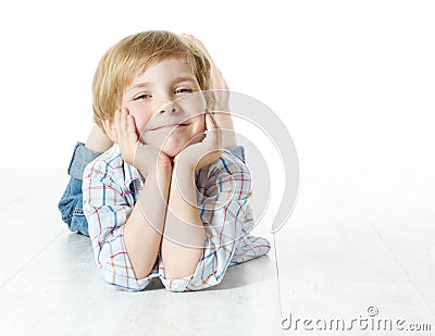 Smiling child lying down, looking at camera Stock Photo