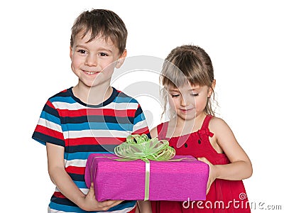 Smiling children hold a gift box Stock Photo