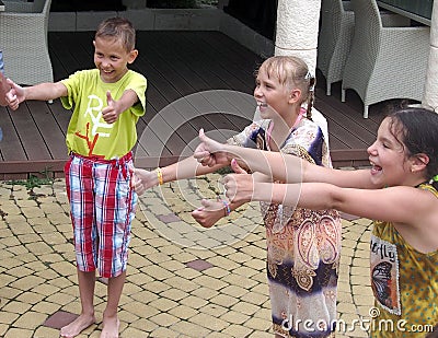 Smiling children make thumbs up outdoor, Sochi, Russia Editorial Stock Photo