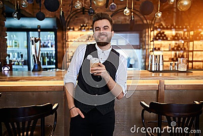 Smiling coffee maker posing to the camera Stock Photo