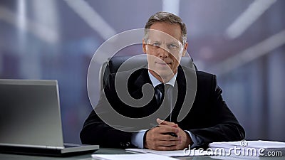 Smiling companys head looking at camera, successful profession and lifestyle Stock Photo