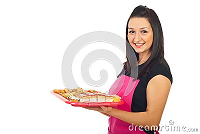 Smiling confectioner woman holding cookies Stock Photo
