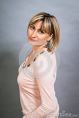 Smiling confident middle-aged blond woman Stock Photo