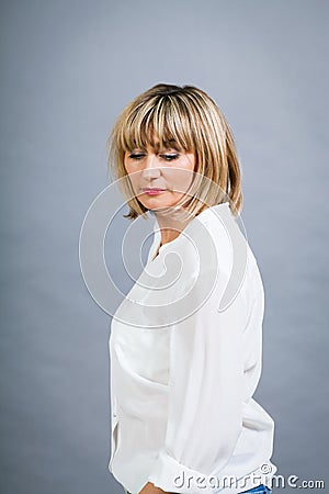 Smiling confident middle-aged blond woman Stock Photo