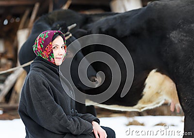 Smiling country girl with a cow Stock Photo