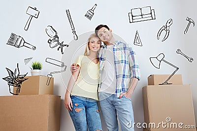 Smiling couple with big boxes moving to new home Stock Photo