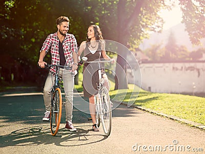 Smiling couple on the bike Stock Photo