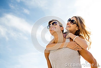 Smiling couple having fun over sky background Stock Photo