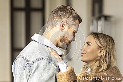 A smiling couple is in love outdoors.A young happy couple embraces on a city street Stock Photo